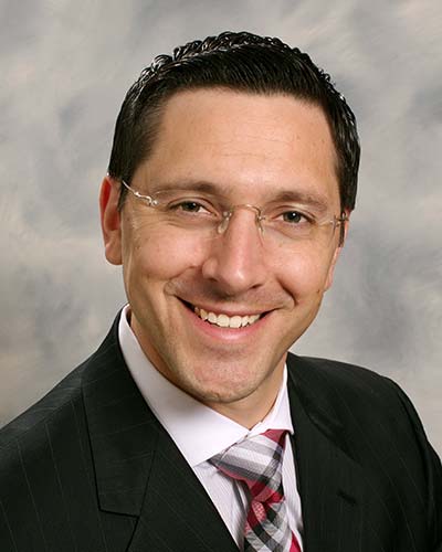 Headshot of attorney Derek A. DeCosmo