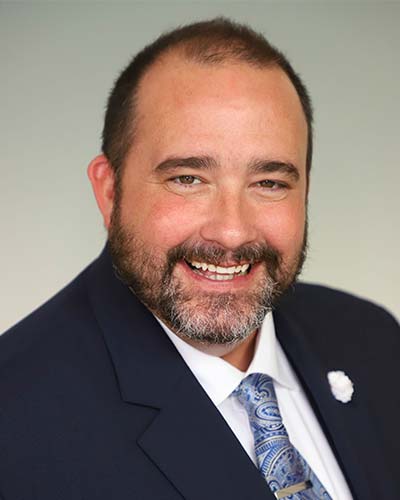 Headshot of attorney Derek A. DeCosmo