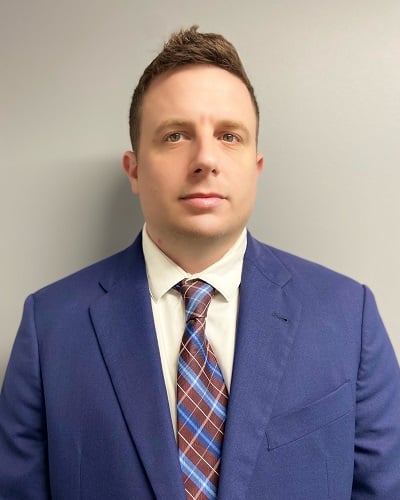 Headshot of attorney Derek A. DeCosmo